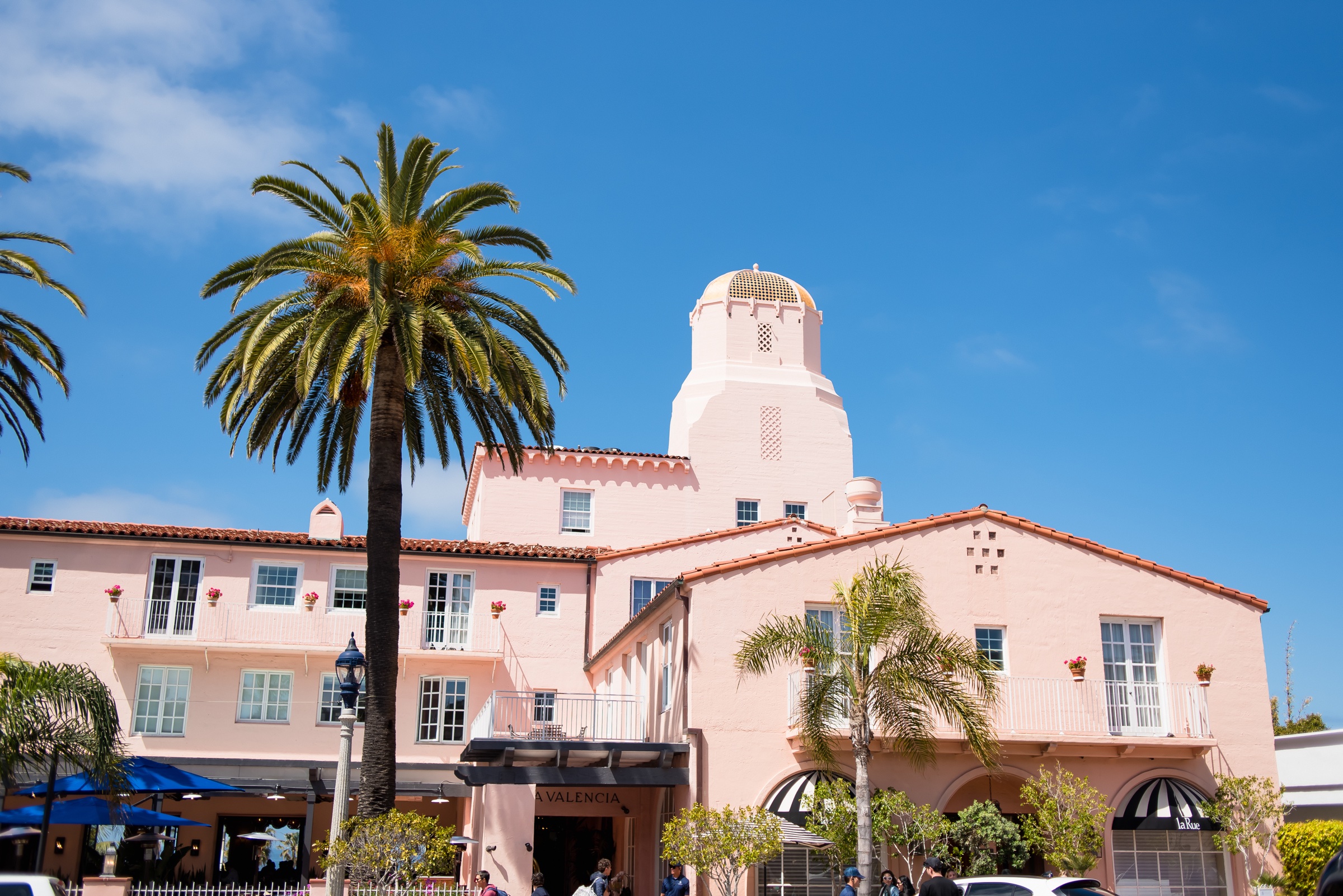 Pink facade and tower of La Valencia Hotel in La Jolla on a wedding day