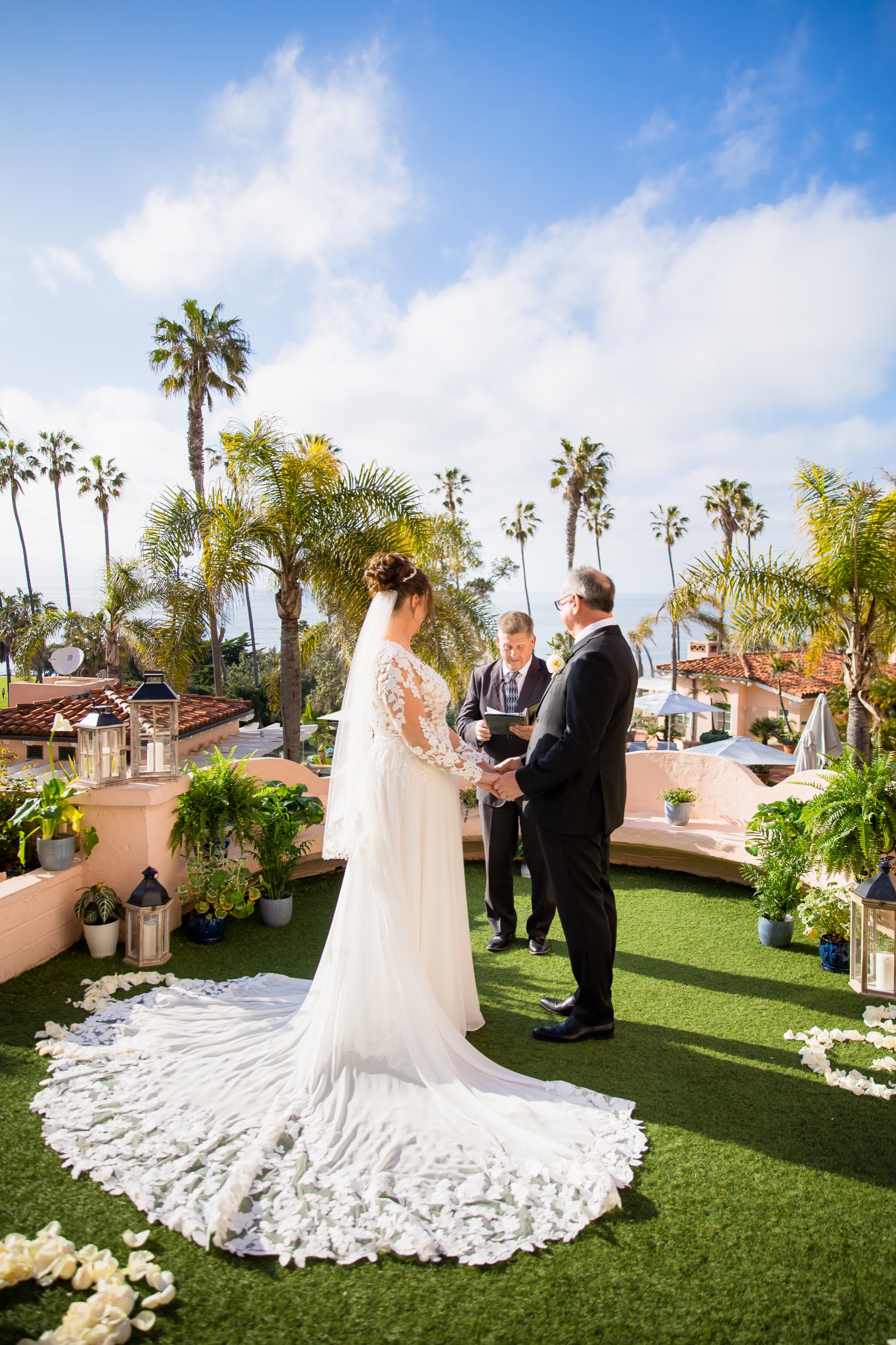 El Jardín wedding ceremony at La Valencia Hotel seen from above with the Pacific and palms behind