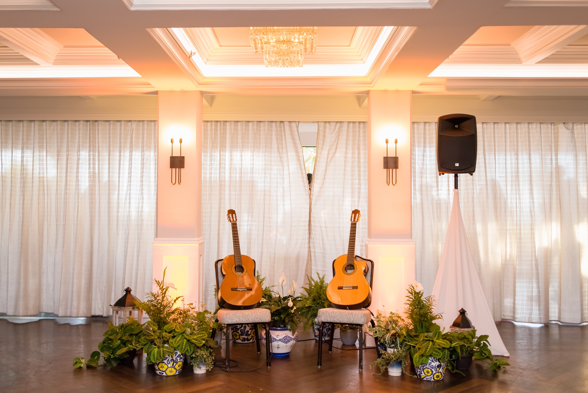 Classical guitar duo setup framed by Spanish ceramic pots and lanterns at a La Valencia Hotel wedding
