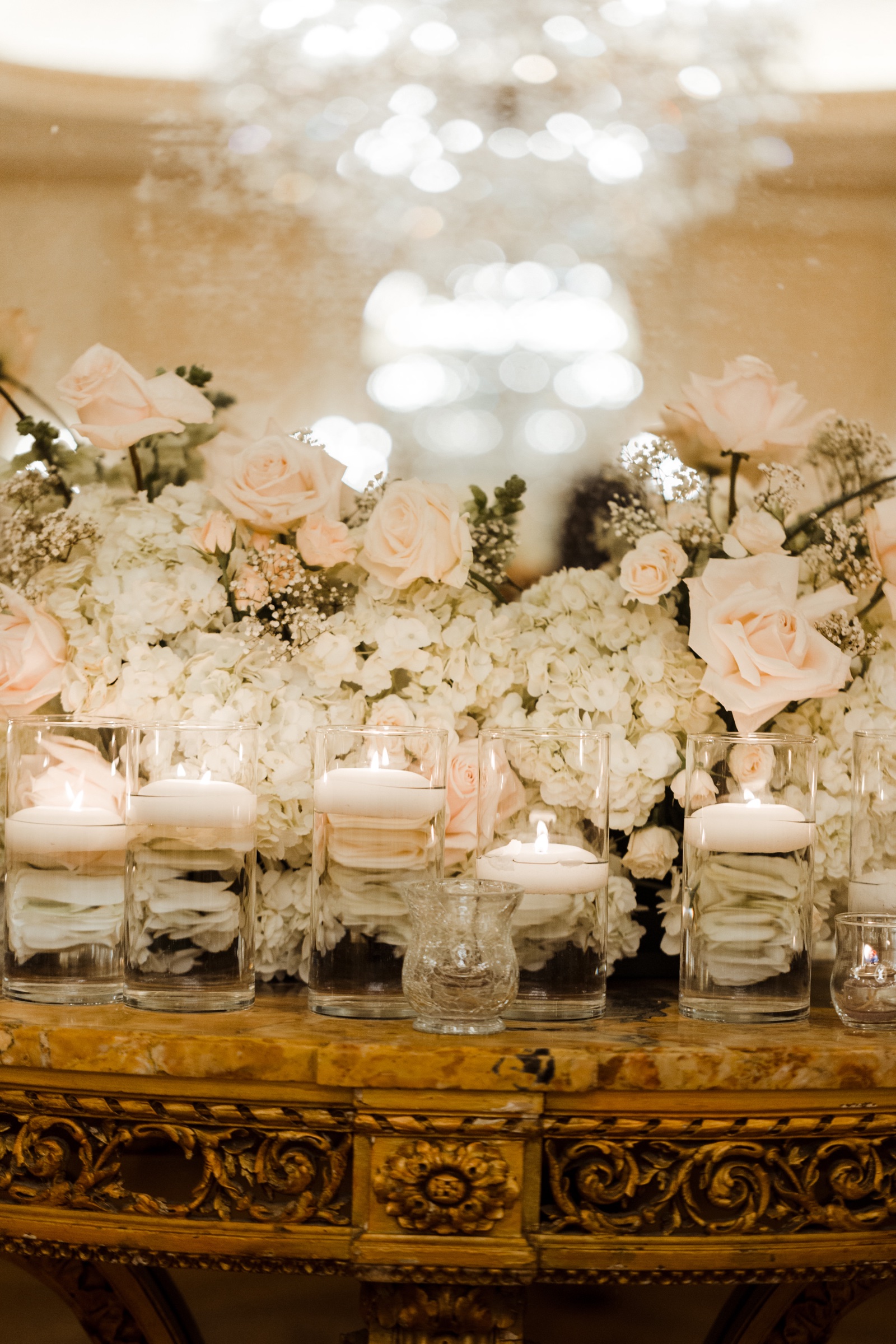 White rose and hydrangea arrangement with crystal and gold accents