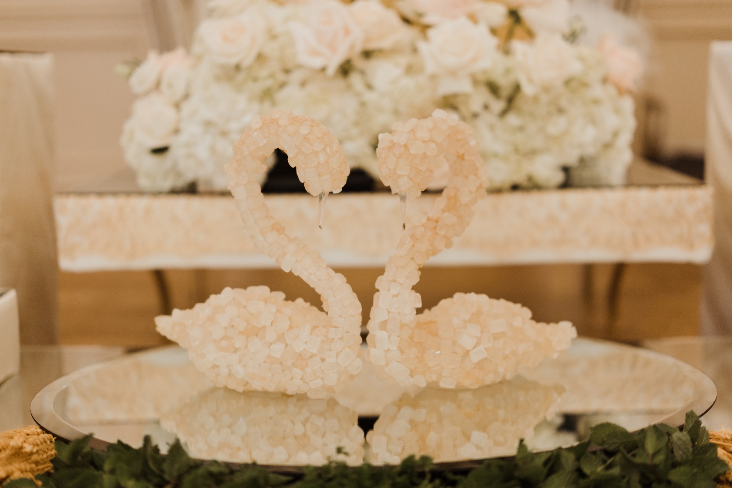 Sofreh Aghd detail with sugar cones, crystal, and white florals
