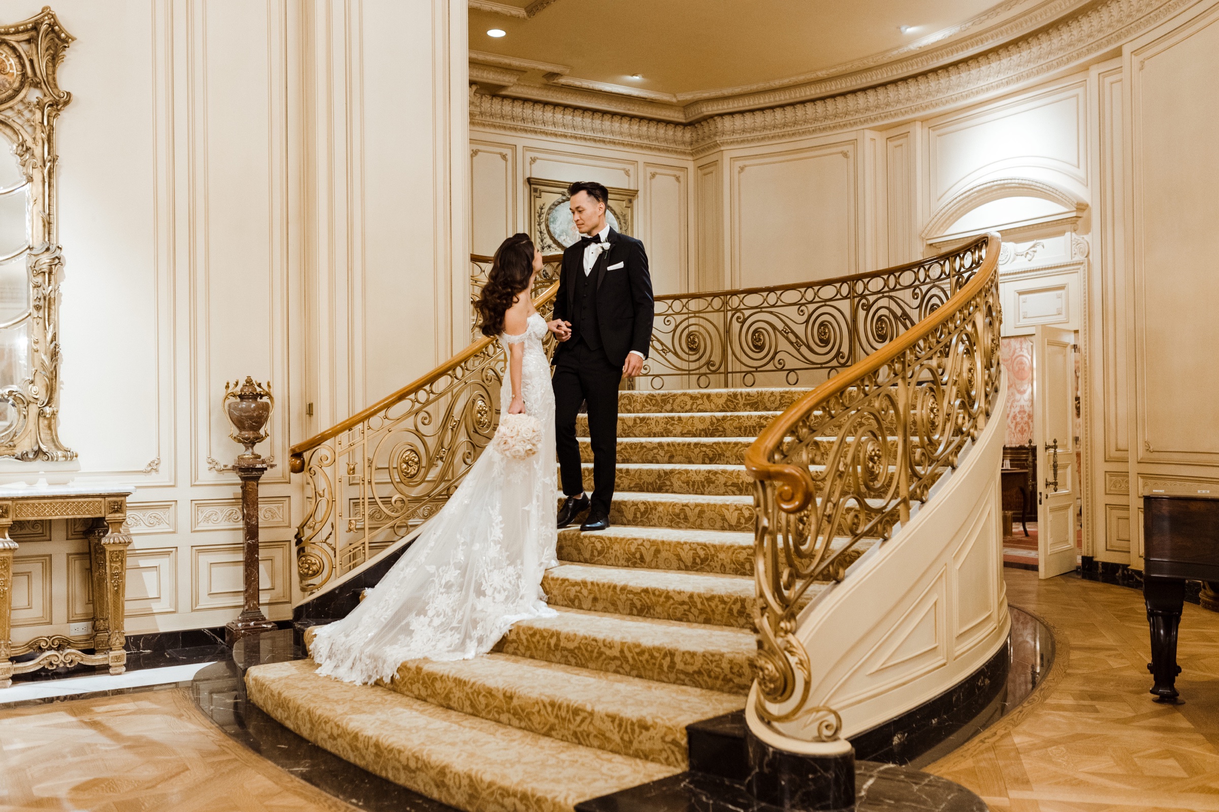 Cherine and Andy on the grand staircase of The Westgate Hotel